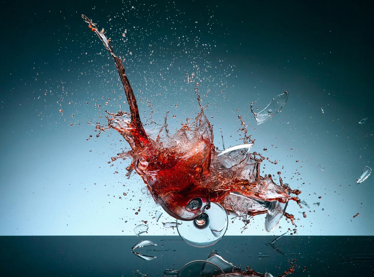 Wine splash and smashing glass photograph by Karl Taylor