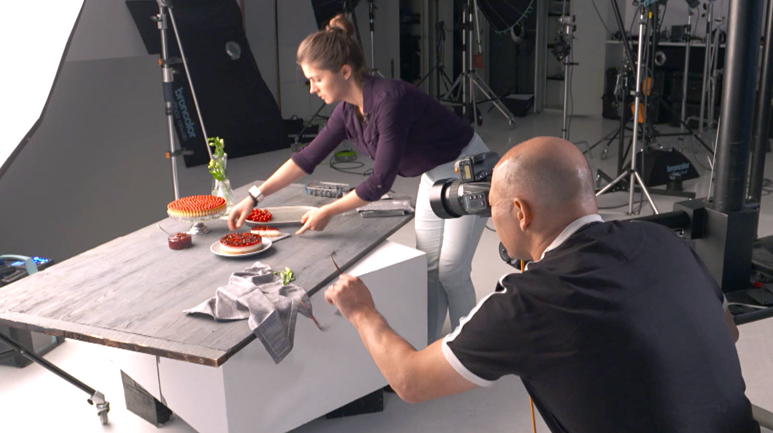 Assistant styling during a food photography shoot